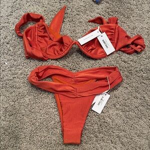 Never worn brand new with tags top med bottoms small Bydee.